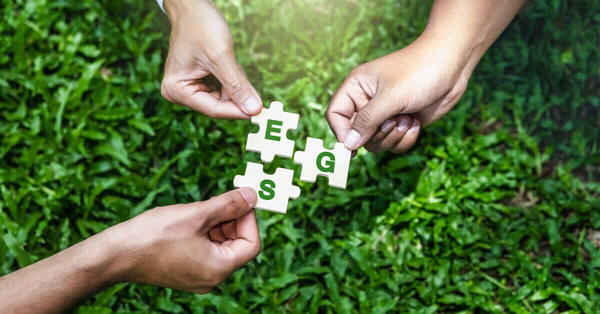 Organica Biotech’s Key Role in Helping You Achieve Your Esg Goals 1 Three hands holding puzzle pieces with "ESG" letters, symbolizing sustainability and environmental goals.