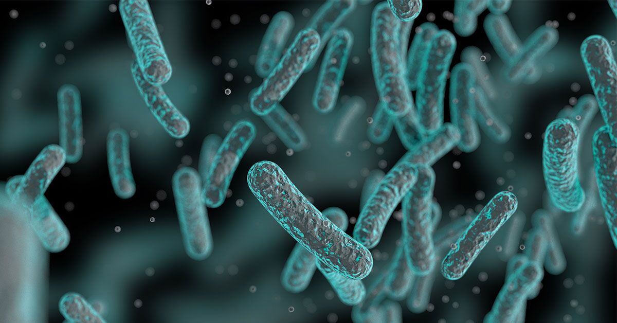 Microbial Heroes: Nature’s Secret Climate Fighters 1 Digital illustration of rod-shaped microbes floating in a blue aquatic environment.