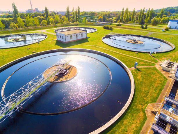 Understanding Hydraulic Loading in Wastewater Treatment Plants 1 Aerial view to sewage treatment plant. Grey water recycling. Waste management in European Union.