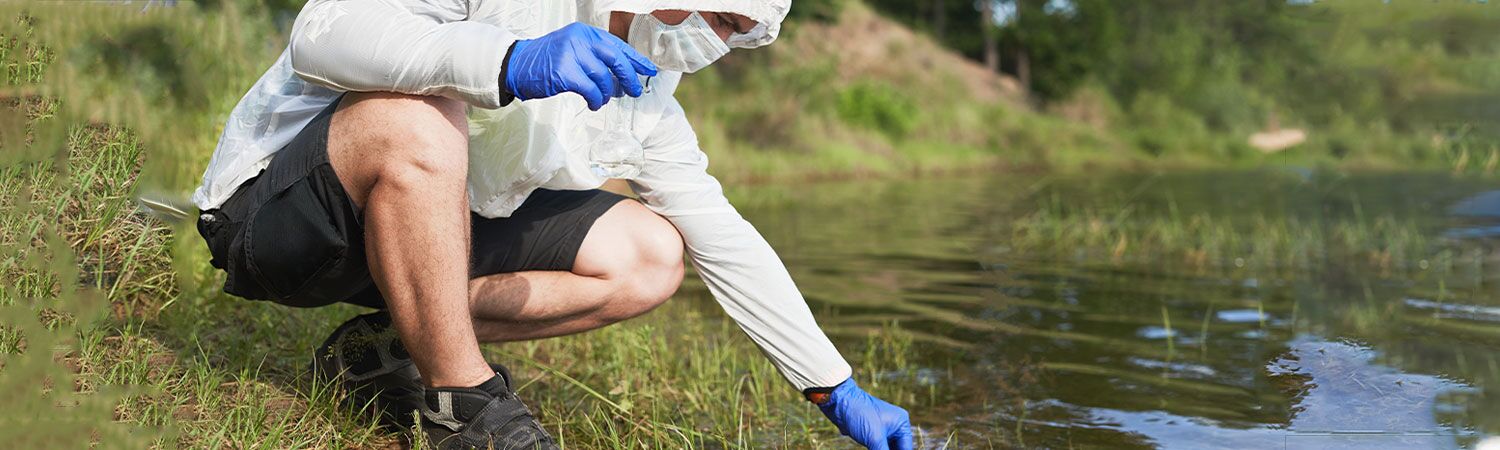 Understanding the Chemical-Free Method to Clean Sludge off the Bottom of a Fish Pond 1 A Scientist Wearing Gloves and a Mask Collects Water Samples from a Lake for Environmental Testing